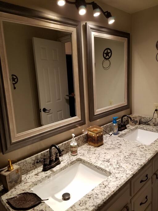 Private bath stocked with towels and supplies for your use. Two sinks.