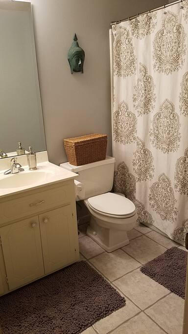 Bathroom - Equipped with shampoo, conditioner, bath bar, hand soap, towels, and toilet paper