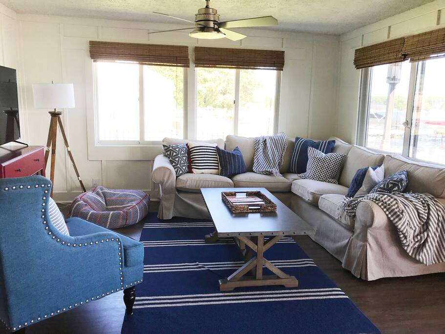 Family room has one TV (with another upstairs in the den). The entire cottage has brand new furniture top-to-bottom! Family room sits 9+, has cable TV, fireplace, and game area