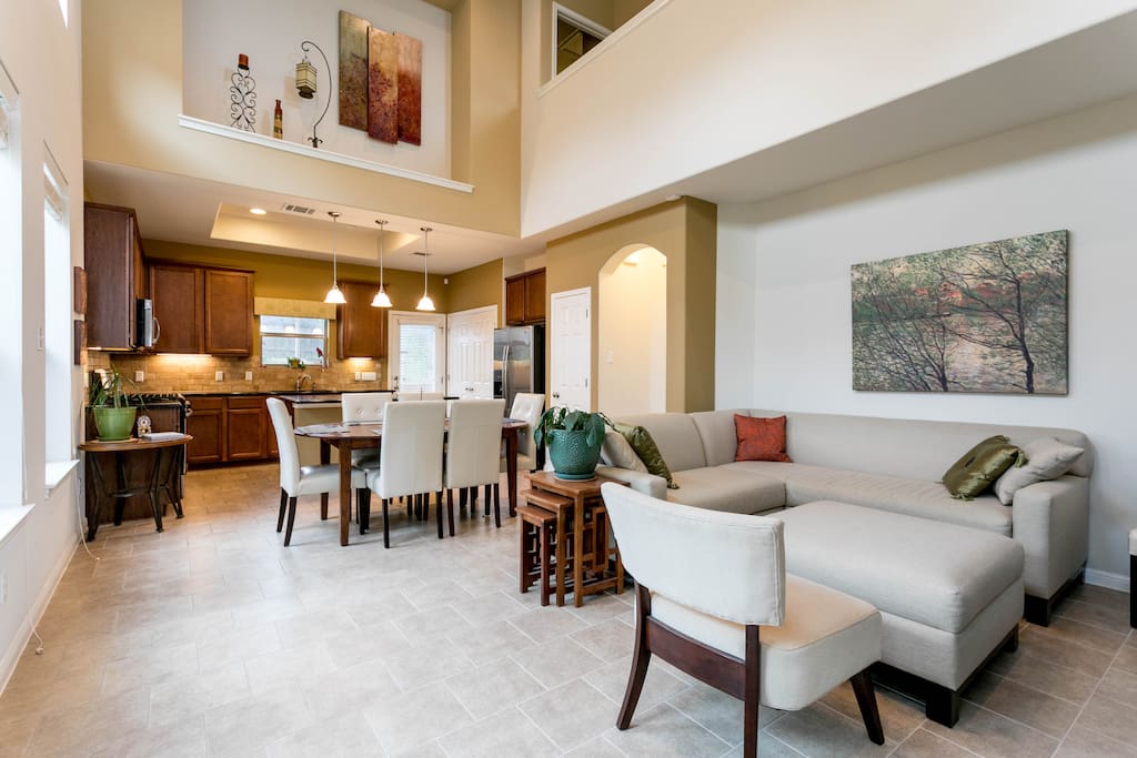 Spacious, lofted kitchen, dining area and living room with vaulted ceilings