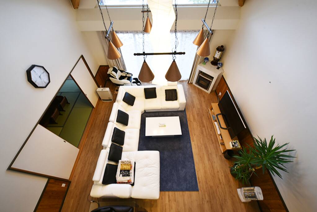 Spacious living room with a high ceiling
