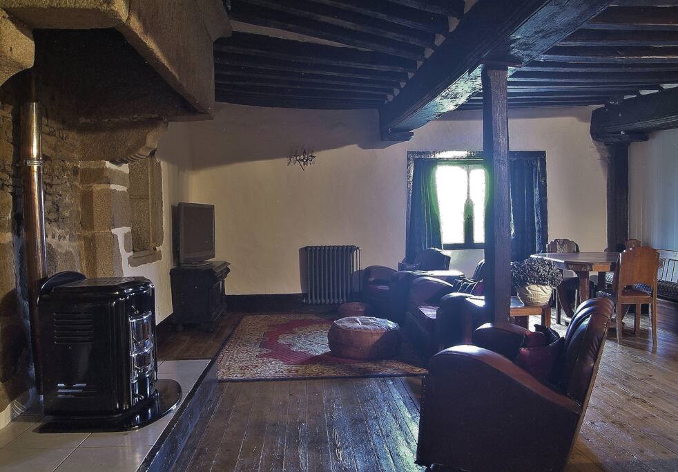 The spacious open plan living room offers a wealth of original features.