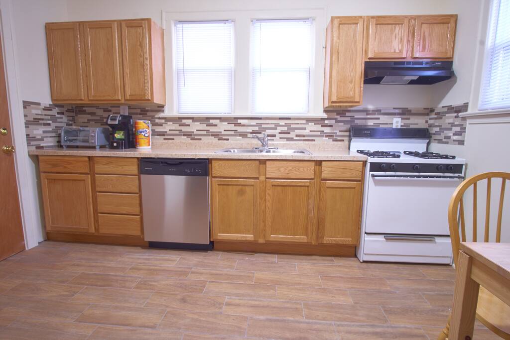 Kitchen w/plates, utensils, pans, k-cup coffee, range, etc.