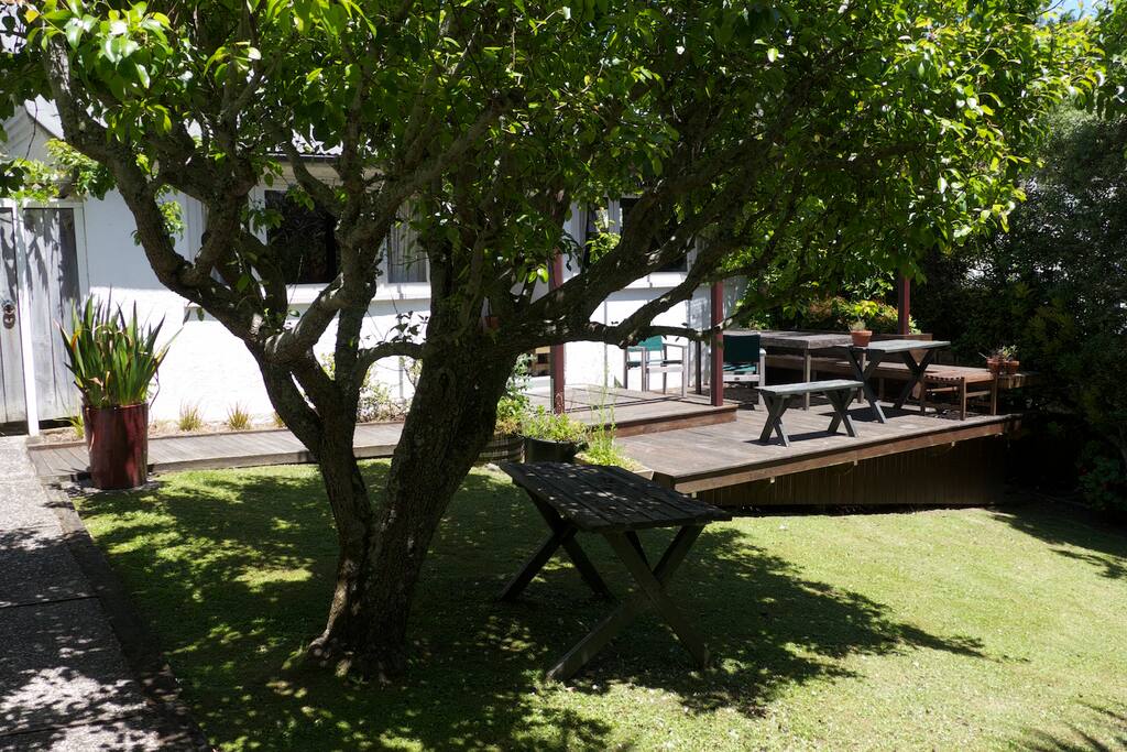 Another view of our front yard and deck. The room that's available is to the left of the front door.