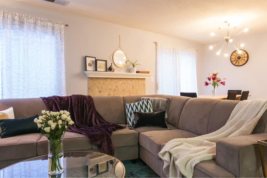 Sit back and relax with friends on the large sofa