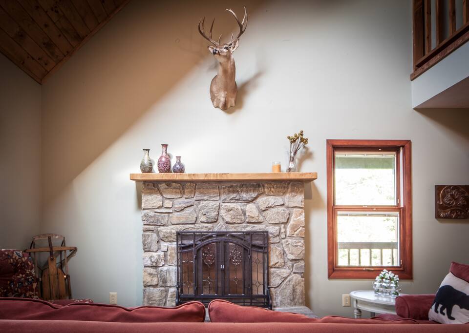 Large stone fireplace with gas logs