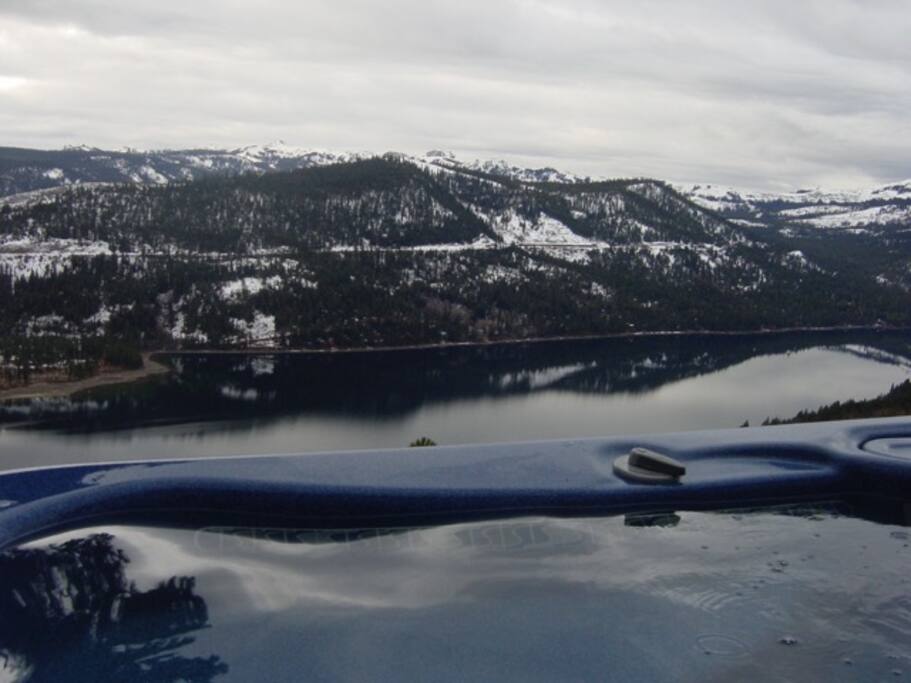 Relax in the hot water and watch the winter storms roll in