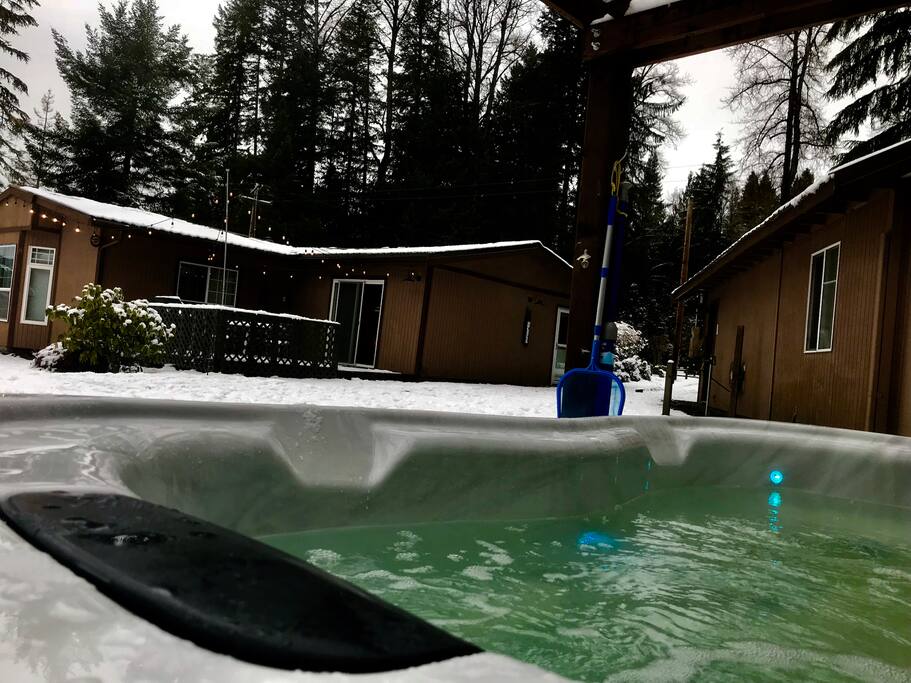 A perfect setting for a peaceful mountain getaway and just steps to a this relaxing deluxe hot tub .