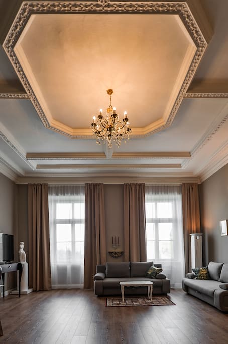 Living room with historical ceiling and chandelier