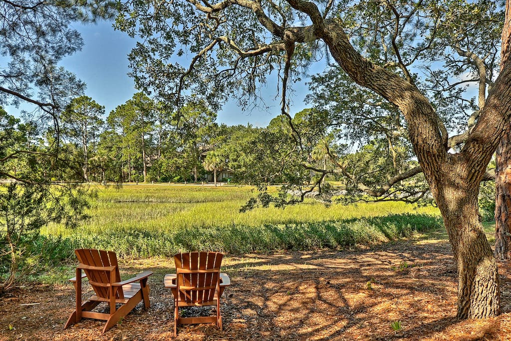 Sip your favorite beverage on 2 Adirondack chairs and take in the peaceful views.