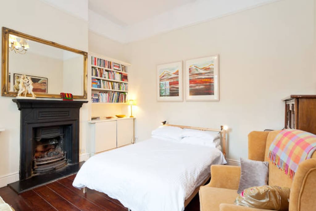 Bedroom one - a very large bright room with a new excellent quality bed as well as a sofa and a piano