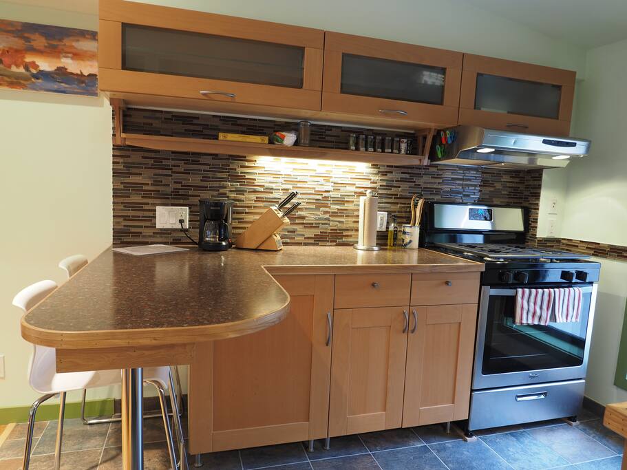 Eat in kitchen with full-sized range and refrigerator.