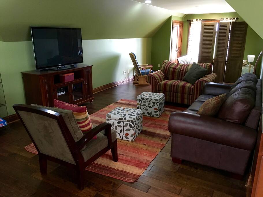 Comfortable living area with wifi, cable tv, wii game system, and AppleTV.