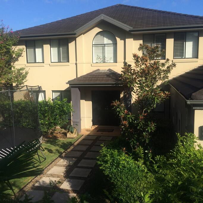 secure front garden with spring free trampoline