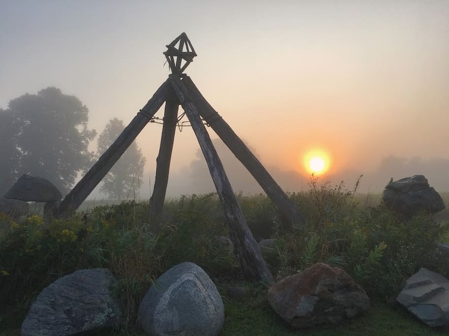 Sculptures and the setting sun