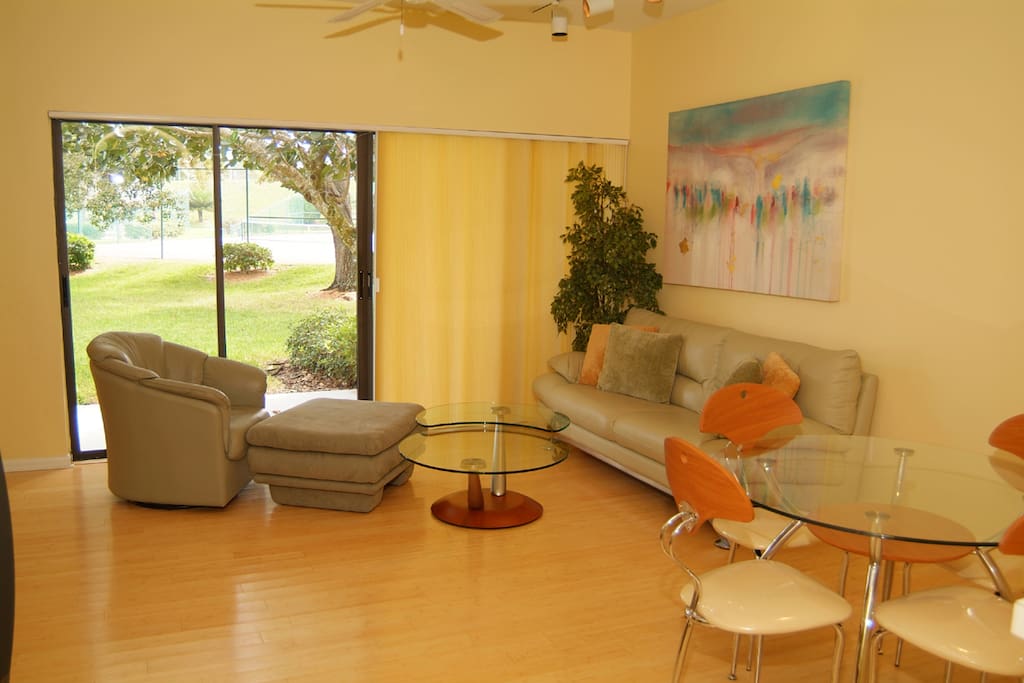 Living Room. Tennis Courtside Condo. View of tennis courts from back patio.