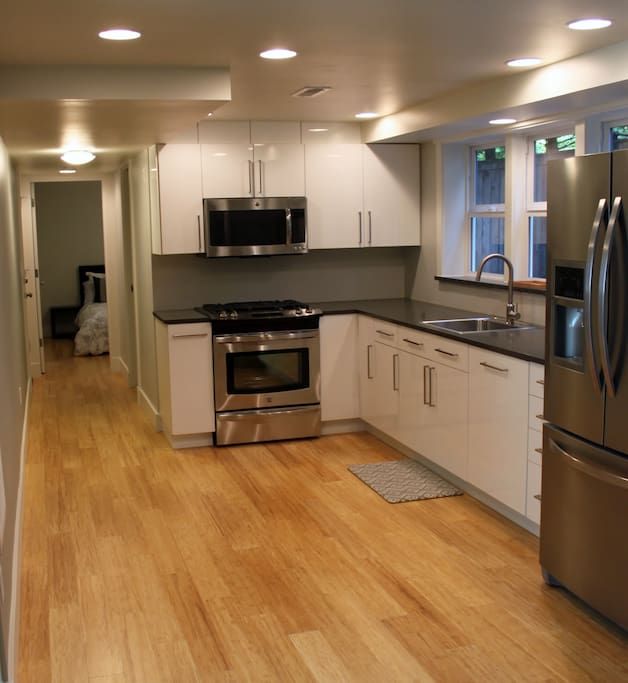 Fully stocked kitchen. Gas stove & oven, microwave, coffee maker, fridge, and dishwasher.