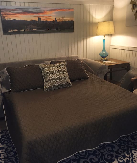 Queen sized pull out couch with a micro-fiber mattress easily sleeps two very comfortably