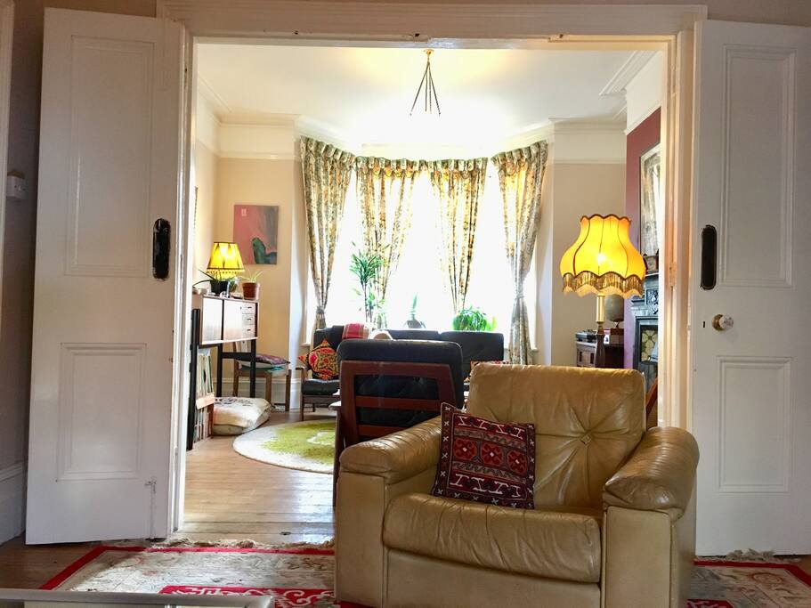 French doors divide the two living room areas .