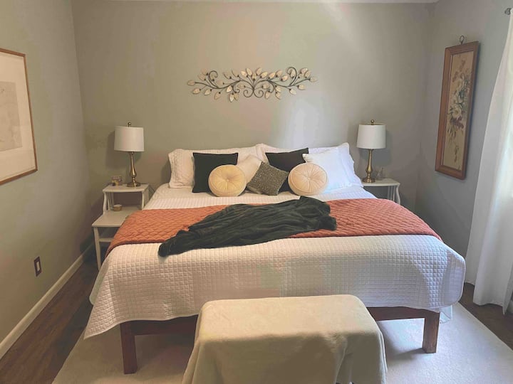 The king bedroom has lots of natural light, and beautiful decor. The mattress is extremely comfortable and the bed platform is handmade by a local artisan virgintimberlumber.com
