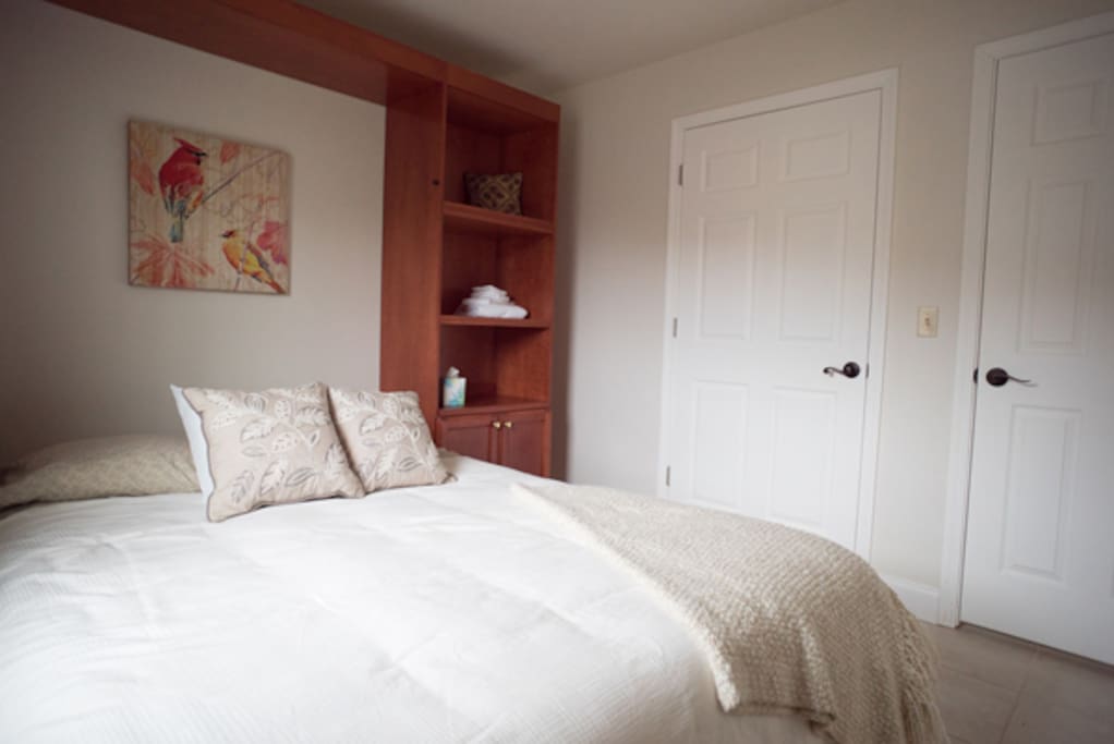 Murphy bed (can fold up against wall for day-use of room)
