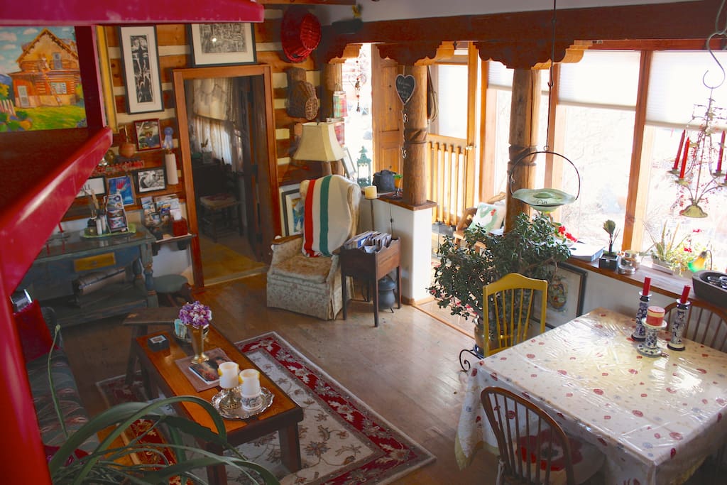 View from the spiral staircase of the living and dining area downstairs.