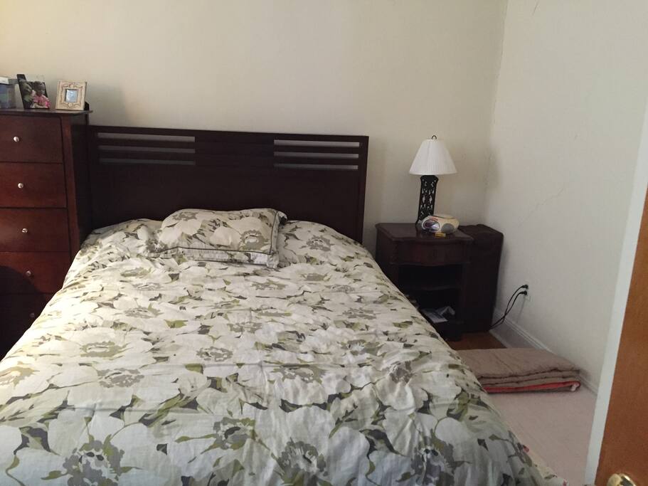 Queen bed in master bedroom (with toddler mattress next to it)