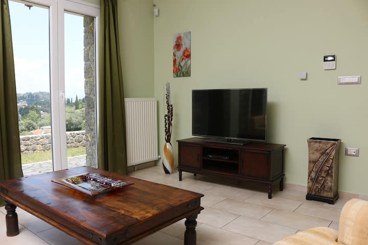 Enjoy your holidays in this state-of-the-art apartment that is part of a large villa overlooking Corfu city.