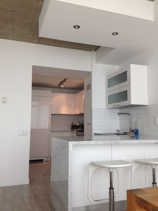 Fully stocked kitchen with breakfast bar