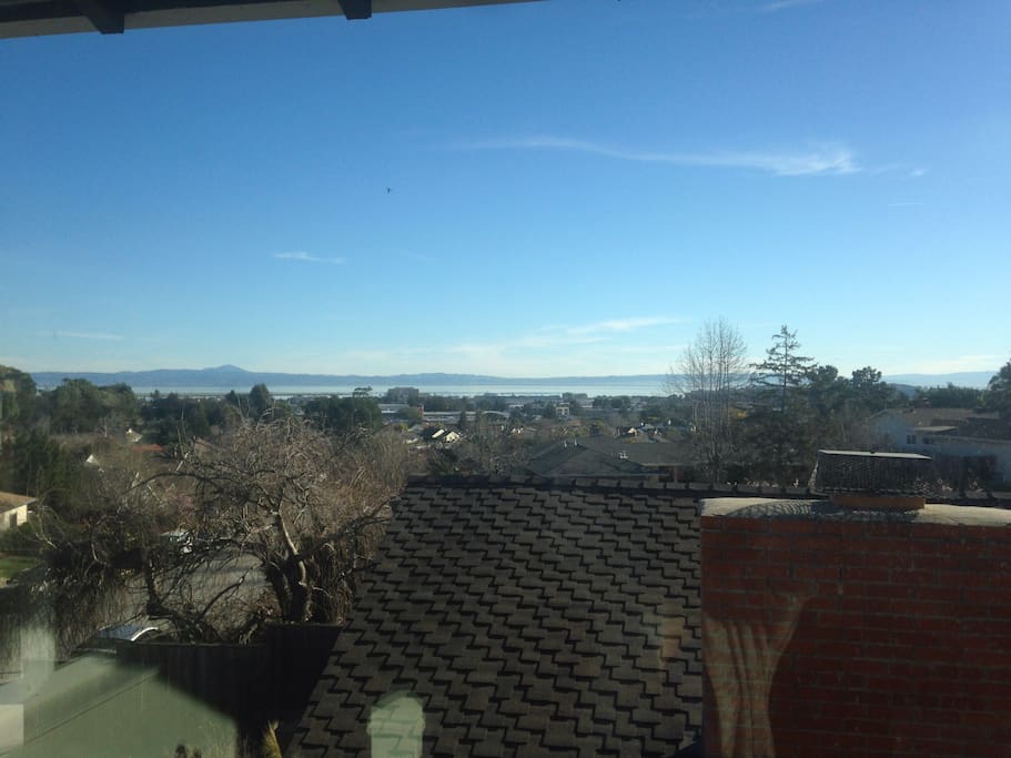 View of the San Francisco Bay and the hills of the east bay. Guests can also enjoy watching planes land at SFO.