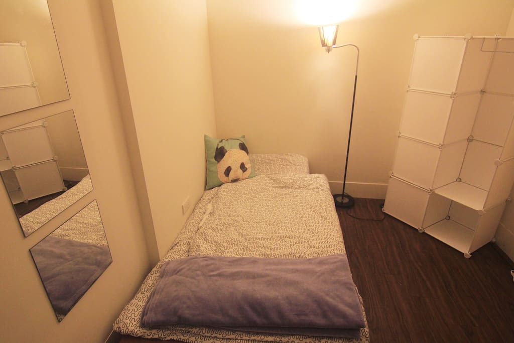 Single bed, table, chair, air-condition.