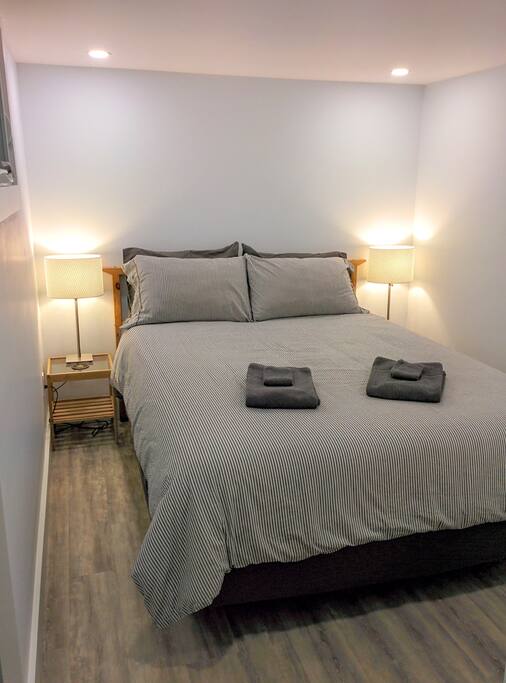 Have a rest in your duvet covered queen sized bed.