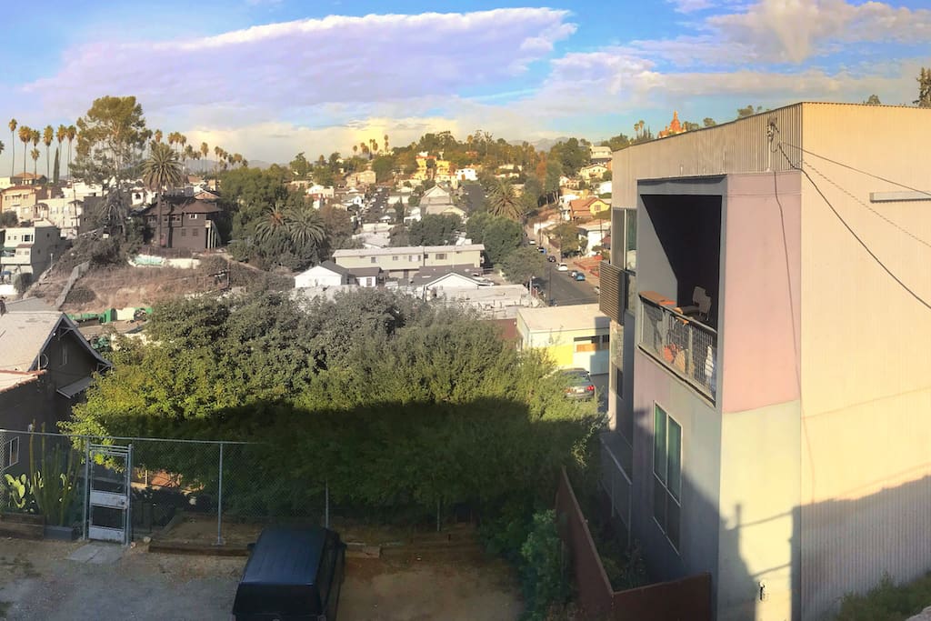 View from balcony. The room has a sliding glass door that opens up to the patio