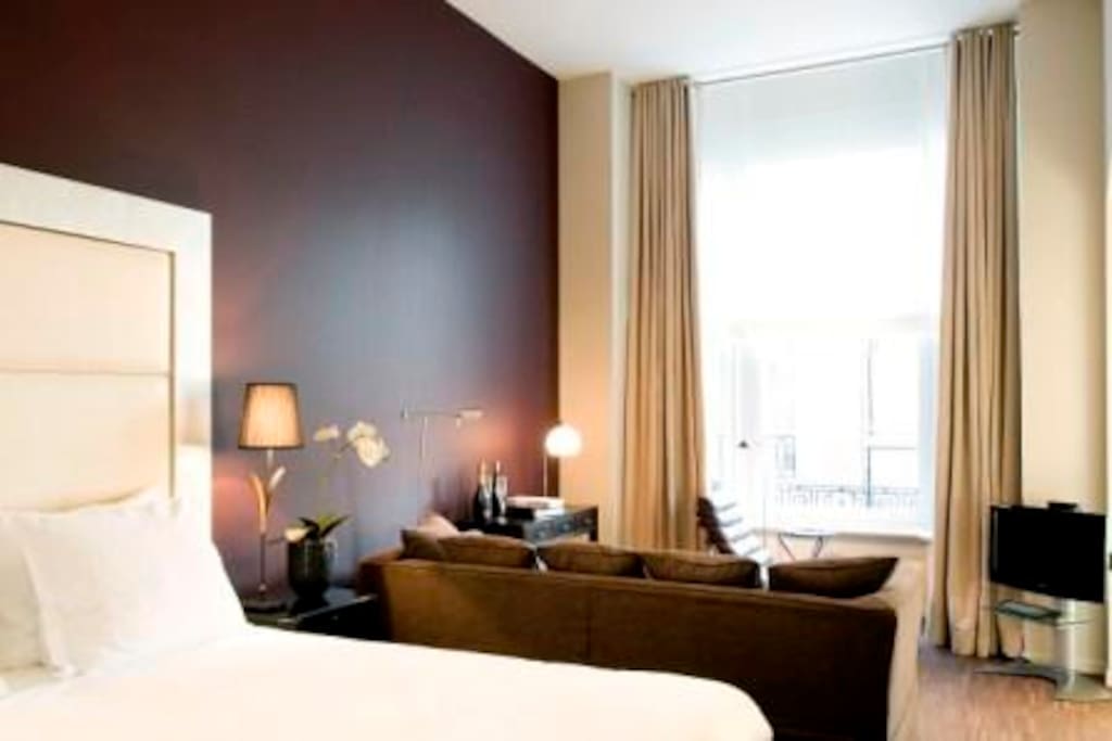 spacious seating with a large comfortable sofa and a chaise longue