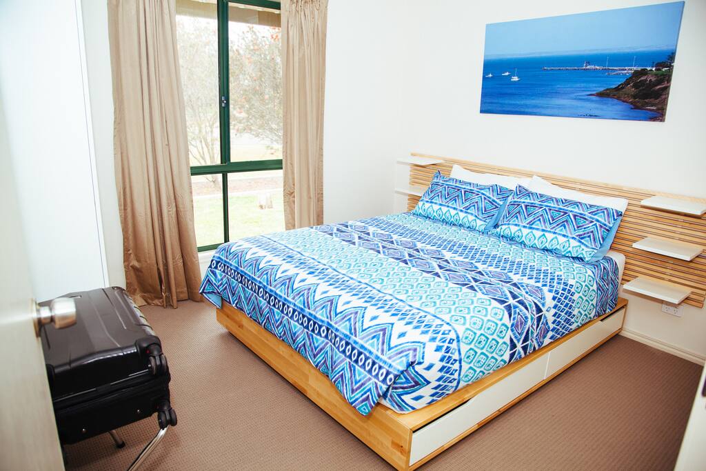 Main queen bedroom also has wardrobes and luggage racks.