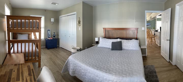 Master bedroom also has a set of twin size bunk beds, desk and  reclining chair.