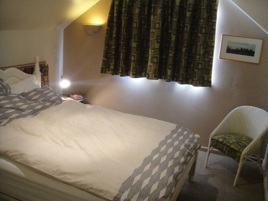 Double bed overlooking garden