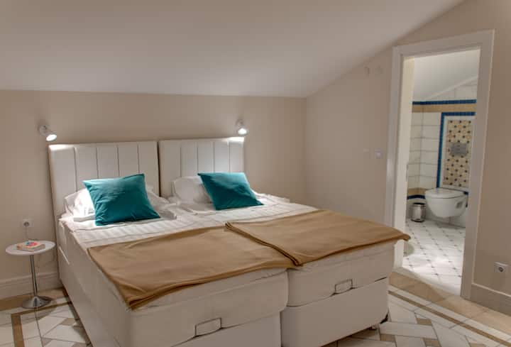 Second floor lounge area with bathroom.