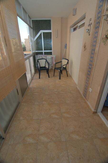 The balcony can easily host multiple people to enjoy drinks and an afternoon.