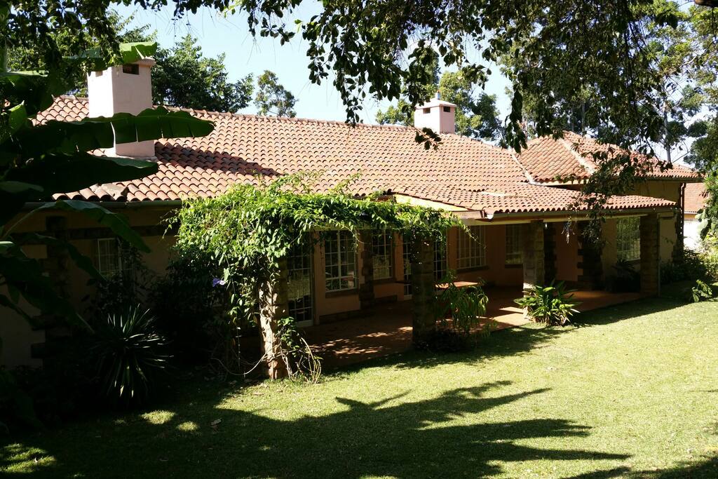 The veranda, stretching all the way from left to right at the back of the house and overlooks the back garden with bananatrees, cactus and much more.