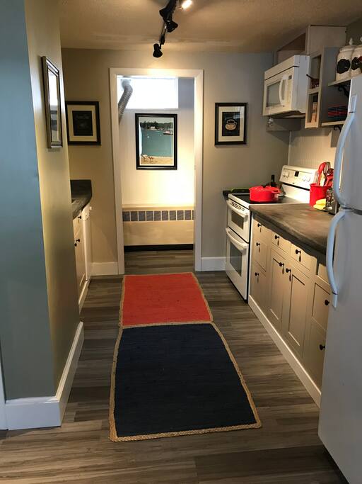Freshly renovated kitchen with dishwasher, double ovens, pantry and washer/dryer to rear