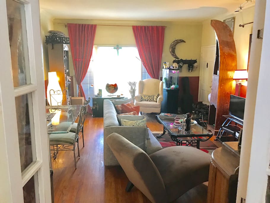 Full view of lounge/entertainment area and dining table.
