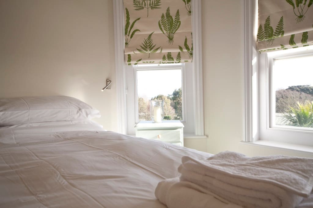 The master bedroom boasts views over the Garden and English Channel