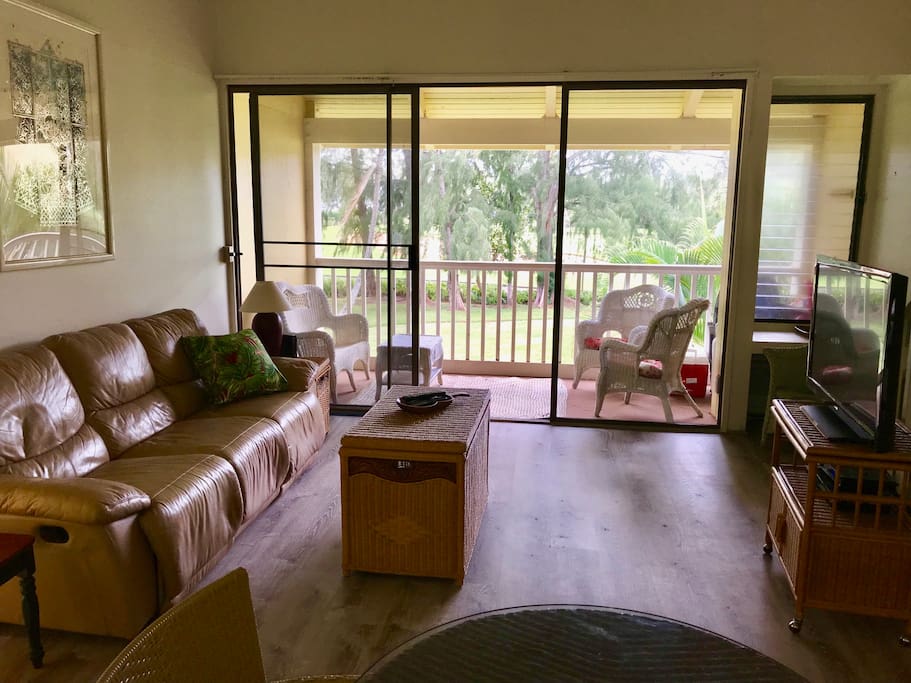 Living room and lanai overlooking 18th hole