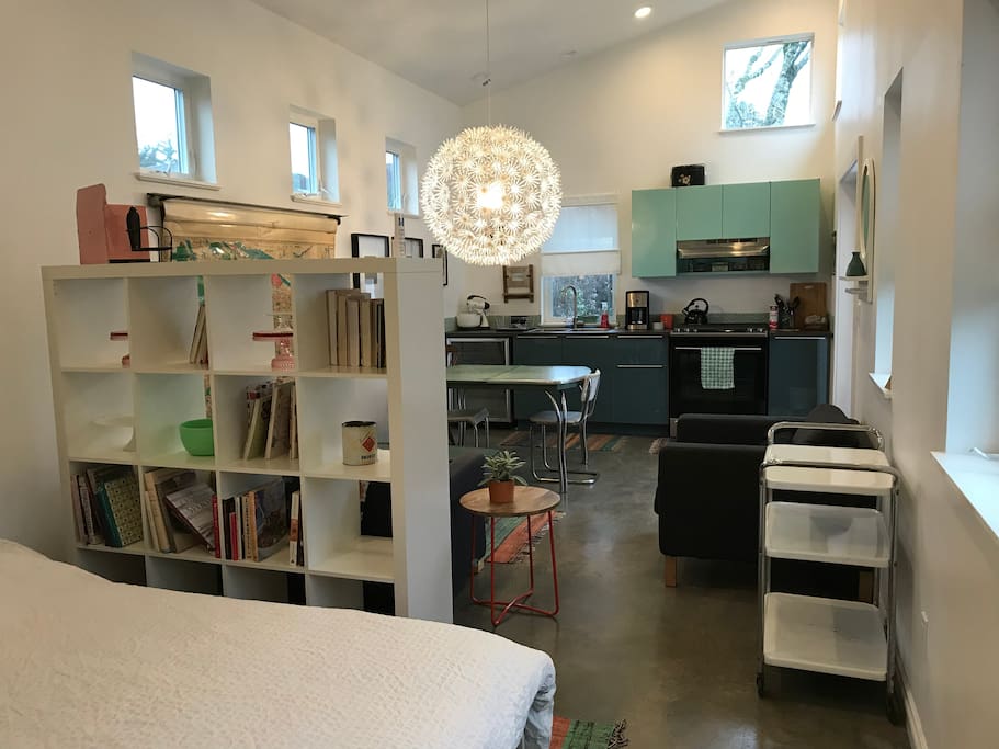 Private studio with kitchen, dining and sitting area in a quiet backyard.