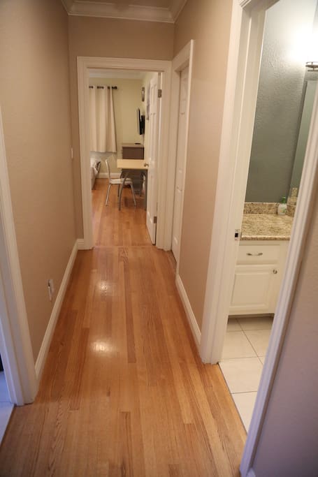 Hallway. Bathroom on the right and kitchen on he left.