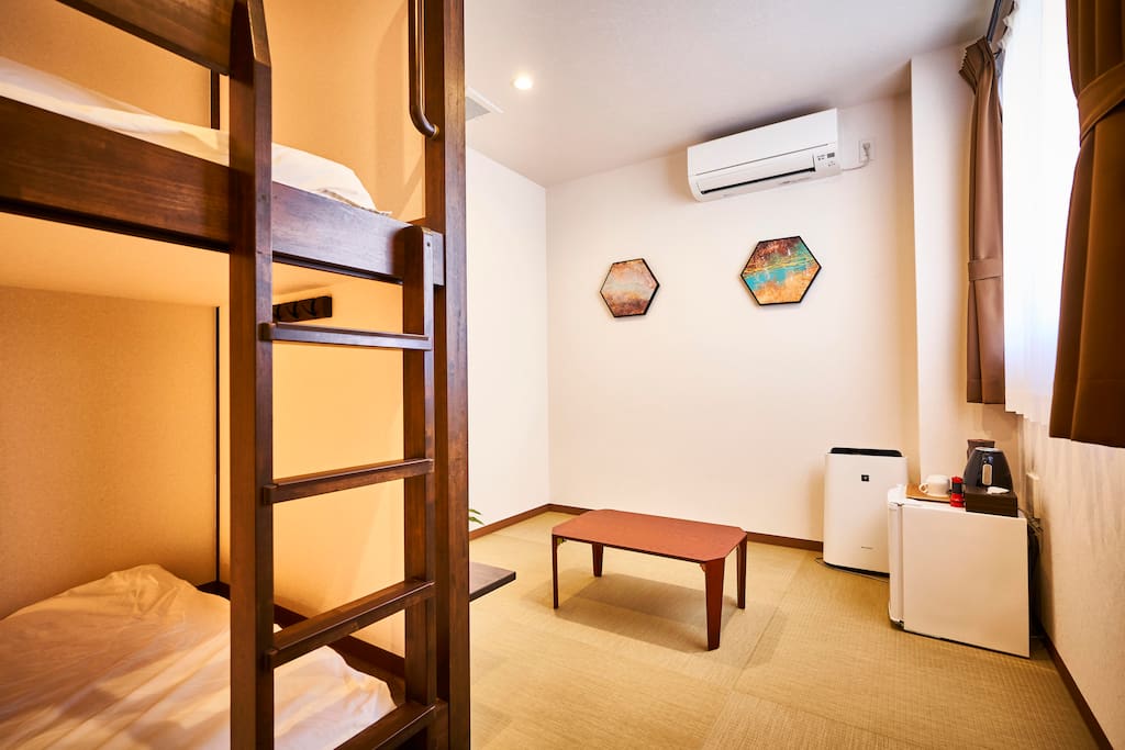 Bedroom with comfortable beds and Japanese-style living.