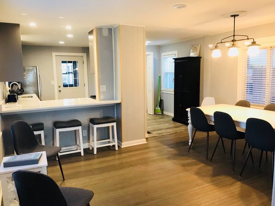 Open dinning room and kitchen bar area with lots of seating.