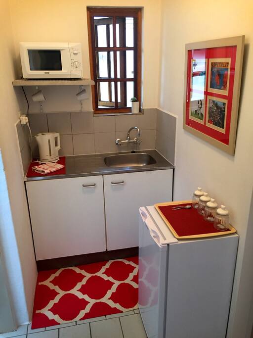 Kitchenette with Fridge, Microwave, Kettle, Toaster and Tea & Coffee.