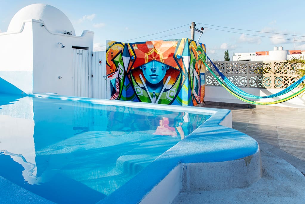 Rooftop with shallow pool (only 40cm deep), hammocks, lounge chairs and wifi